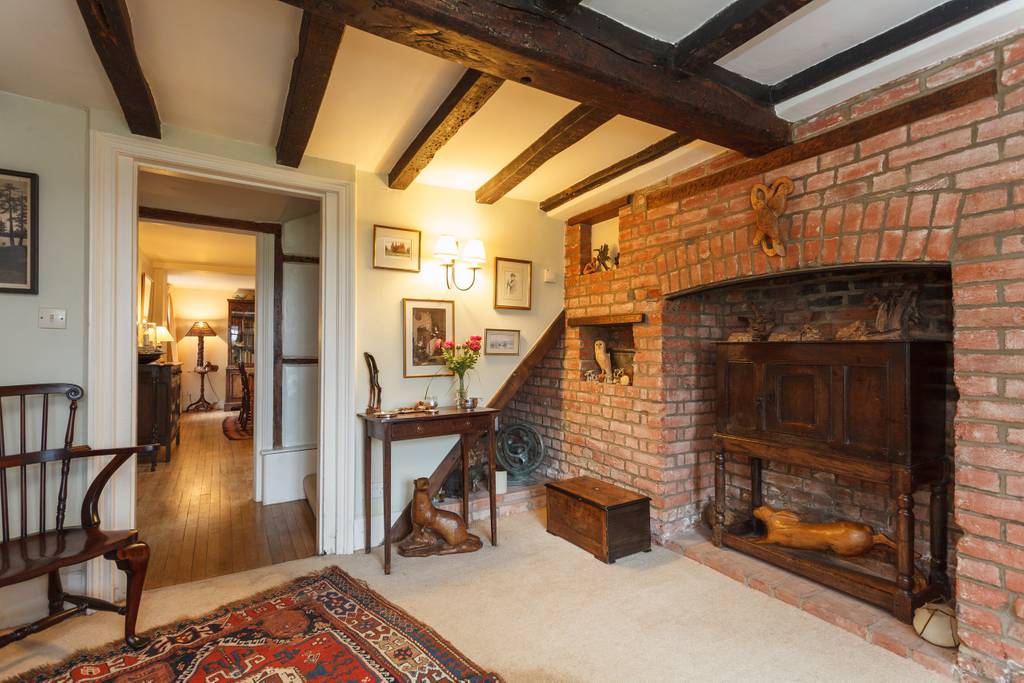 Hallway with massive inglenook fireplace